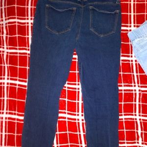 Size 7 blue jeans and a  size medium red shirt